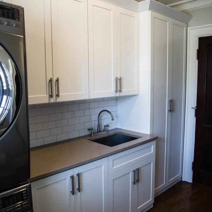Custom laundry room cabinet installation by Galvez North Mississippi