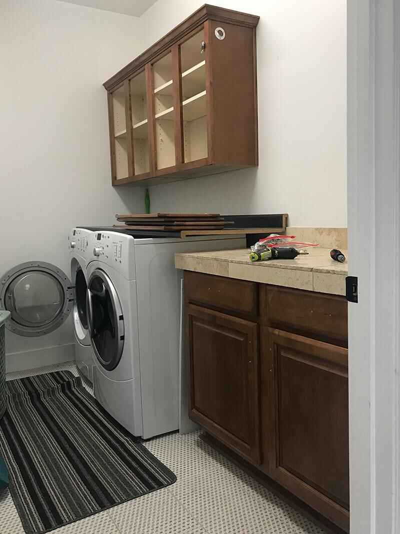 Laundry room remodeling in progress cabinetry installation