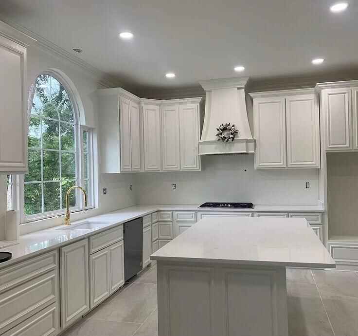 Custom kitchen cabinetry and island by Galvez Construction